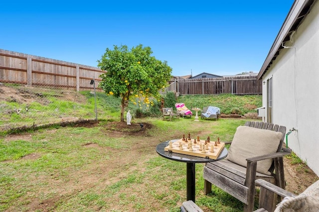 view of yard with a fenced backyard