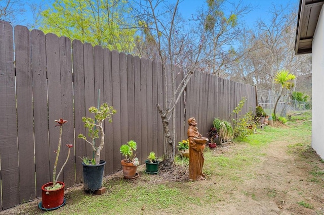 view of yard with a fenced backyard