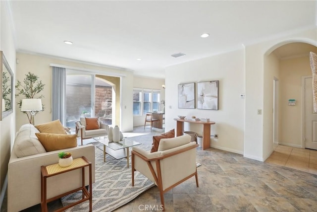 living room featuring visible vents, recessed lighting, arched walkways, crown molding, and baseboards