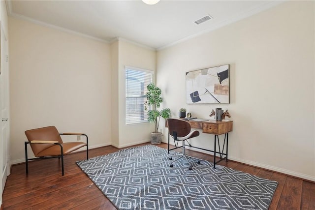 home office featuring visible vents, wood-type flooring, baseboards, and ornamental molding