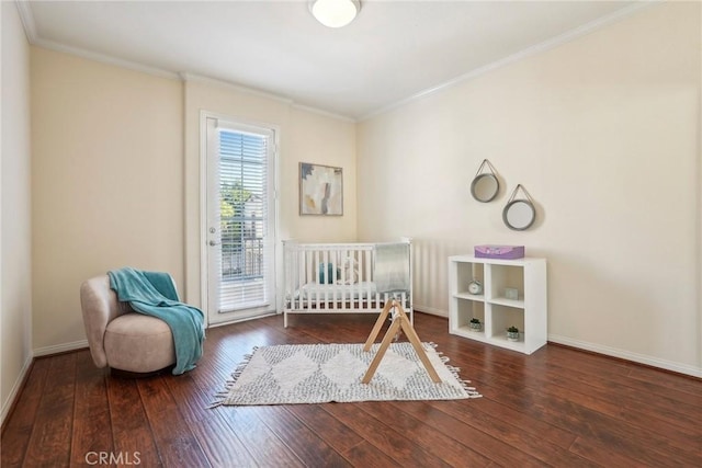 bedroom with hardwood / wood-style floors, crown molding, access to outside, and baseboards