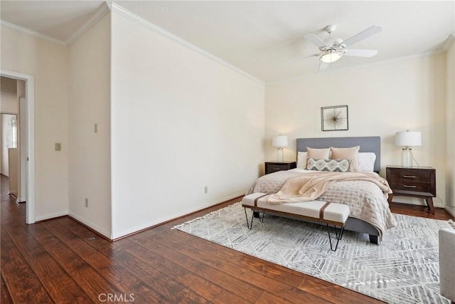 bedroom featuring ceiling fan, baseboards, hardwood / wood-style floors, and ornamental molding