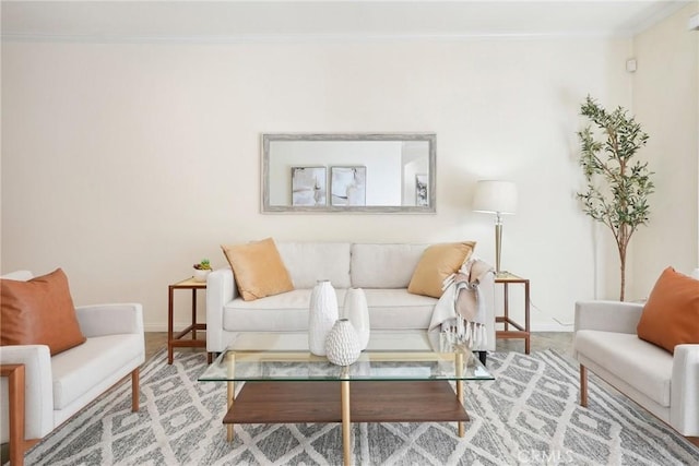 living room with crown molding and baseboards