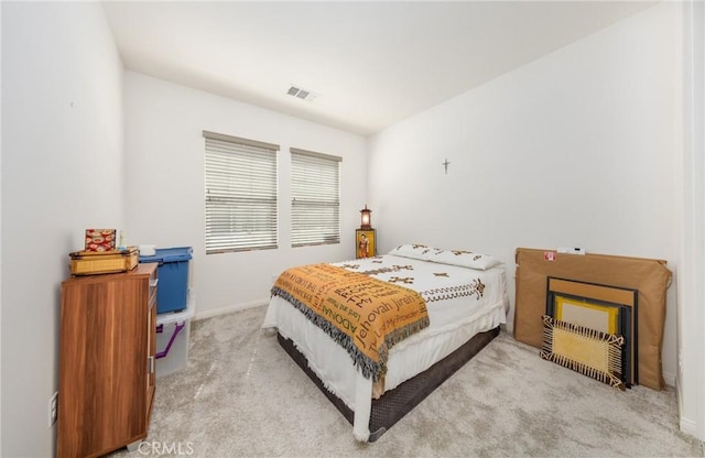 bedroom featuring visible vents, baseboards, and carpet flooring