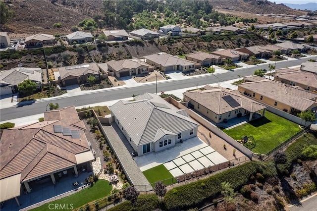 birds eye view of property with a residential view and a mountain view