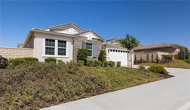 single story home featuring stucco siding, driveway, fence, a garage, and a tiled roof