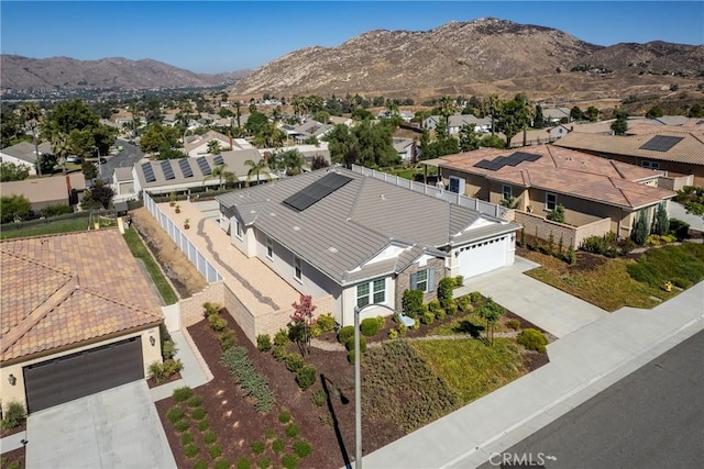 aerial view featuring a mountain view and a residential view