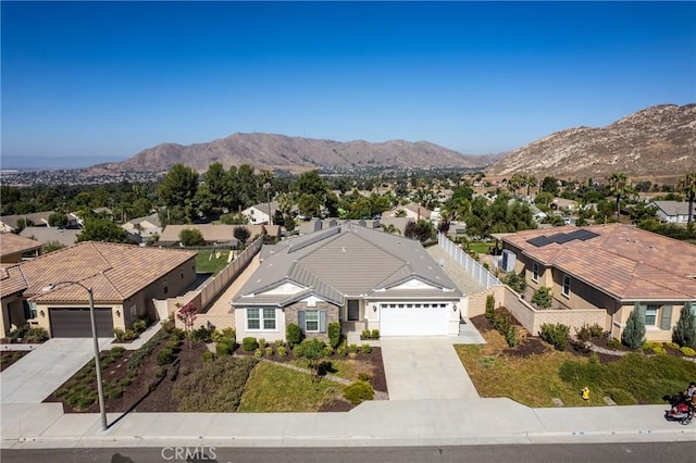 aerial view featuring a mountain view and a residential view