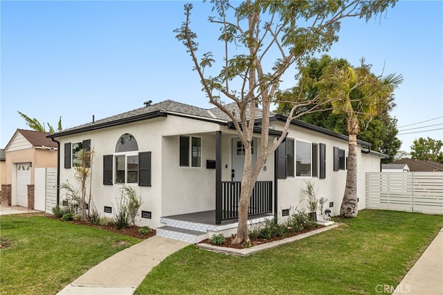 bungalow featuring crawl space, stucco siding, a front yard, and fence