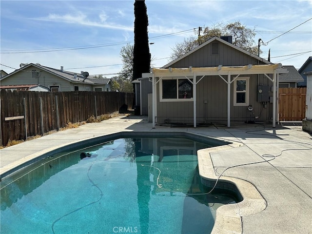 view of swimming pool featuring a patio area, a fenced in pool, and a fenced backyard