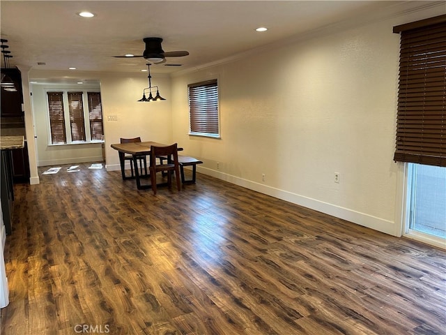 dining area featuring dark wood-style floors, recessed lighting, baseboards, and ornamental molding
