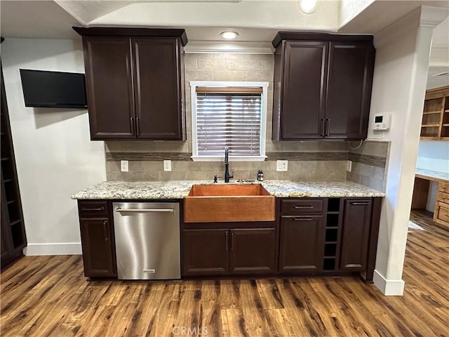 kitchen with dark wood-type flooring, a sink, stainless steel dishwasher, dark brown cabinetry, and decorative backsplash