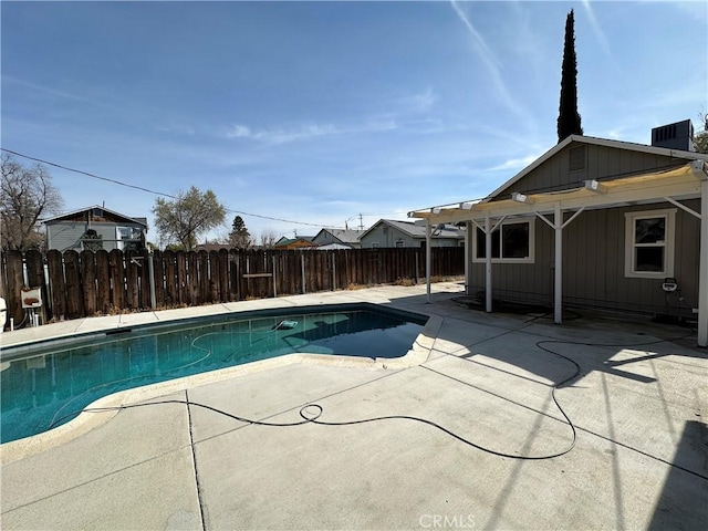 view of pool with a fenced in pool, a fenced backyard, and a patio area