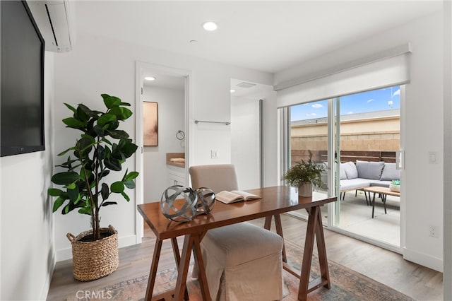 home office with recessed lighting, baseboards, and wood finished floors