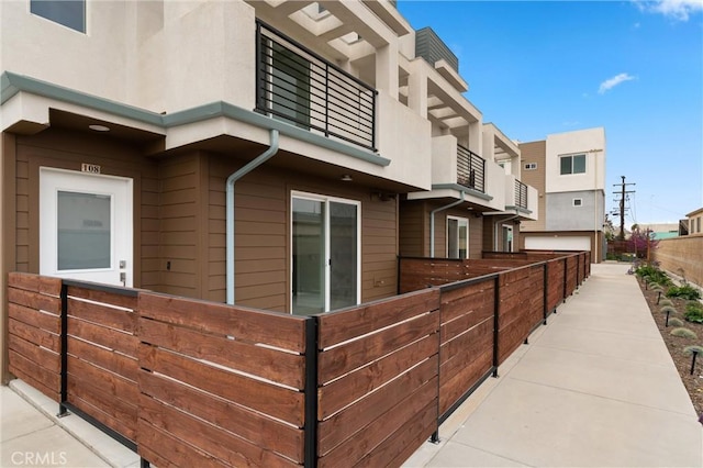 view of side of property with fence