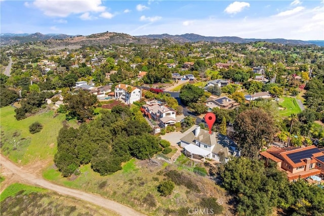 birds eye view of property with a mountain view and a residential view