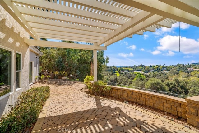 view of patio / terrace with fence and a pergola