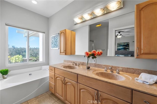 bathroom with a sink, a garden tub, double vanity, and tile patterned flooring