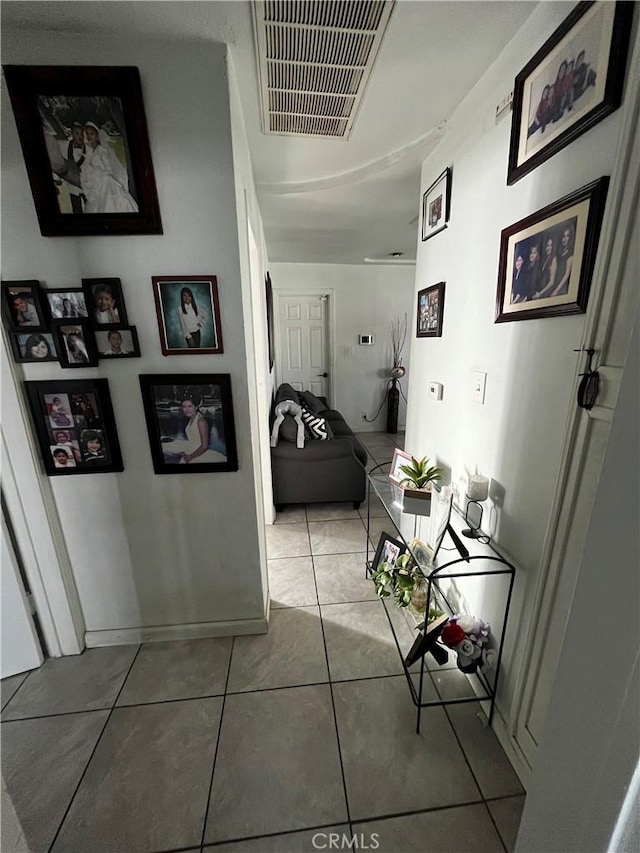 corridor with tile patterned flooring and visible vents