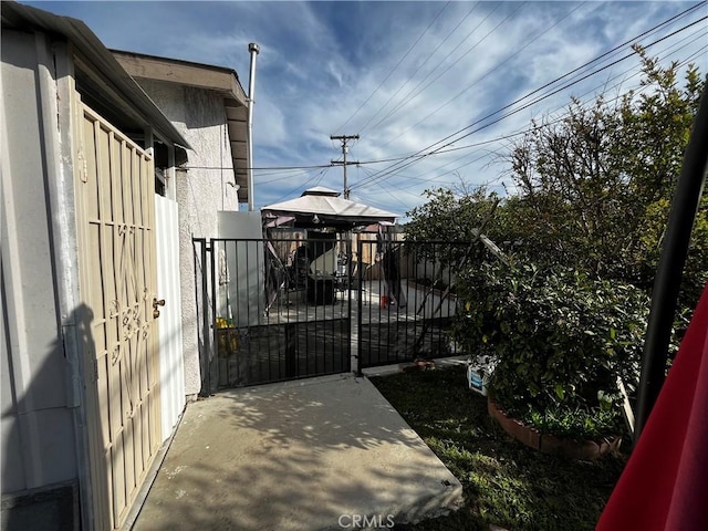 view of gate featuring fence