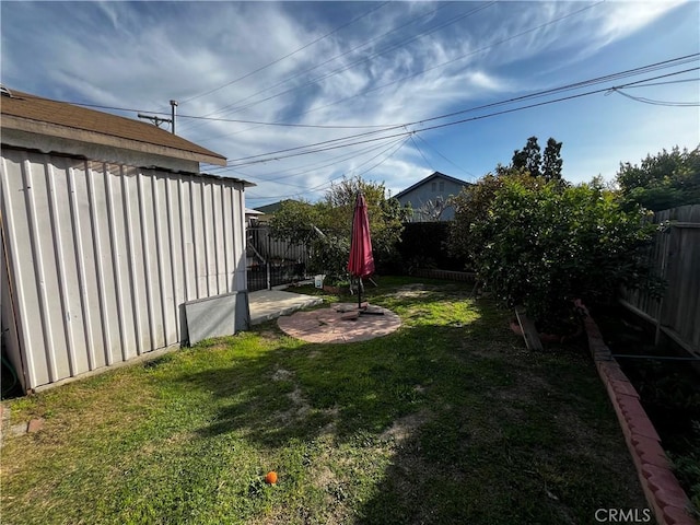 view of yard featuring a patio area and a fenced backyard