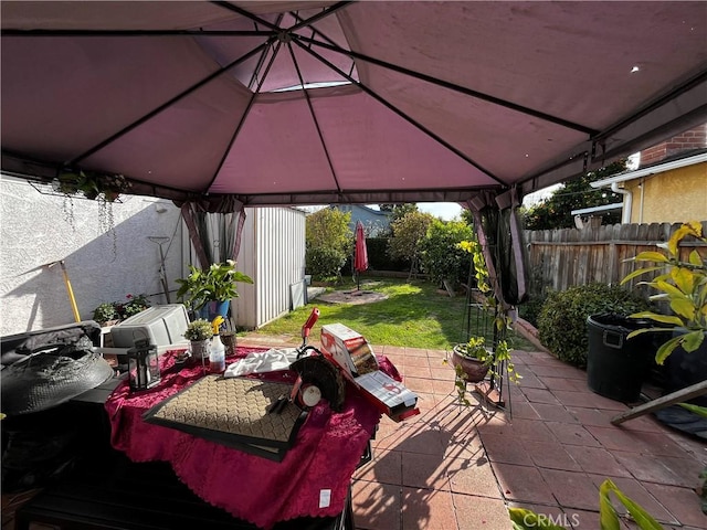 view of patio / terrace featuring a gazebo and fence