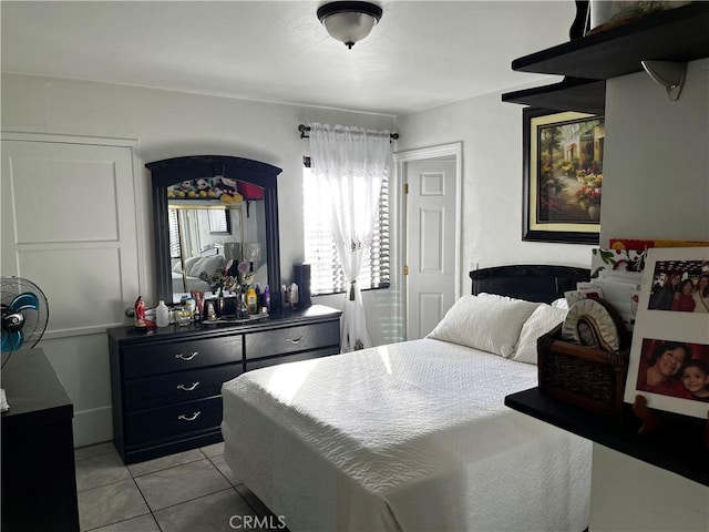 bedroom featuring light tile patterned flooring