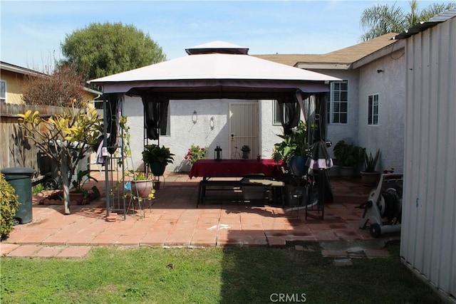 view of patio featuring a gazebo and fence