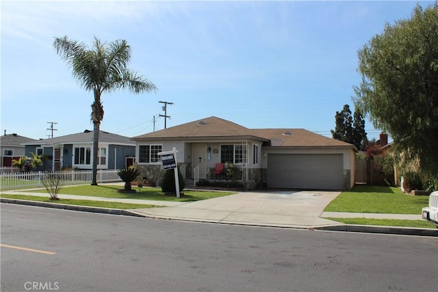 ranch-style home featuring stucco siding, a front lawn, fence, concrete driveway, and a garage