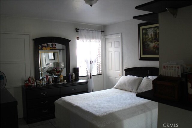 bedroom featuring tile patterned flooring
