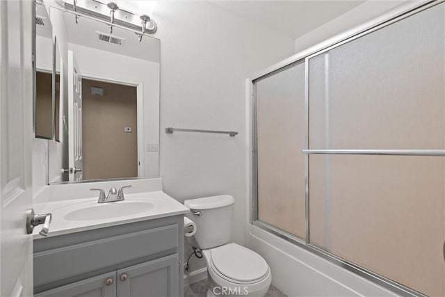 full bathroom with visible vents, enclosed tub / shower combo, toilet, and vanity