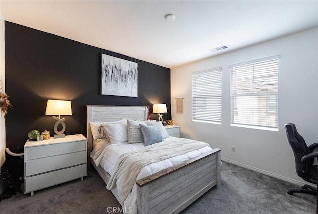 bedroom featuring carpet flooring, baseboards, and visible vents