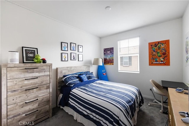 carpeted bedroom with baseboards