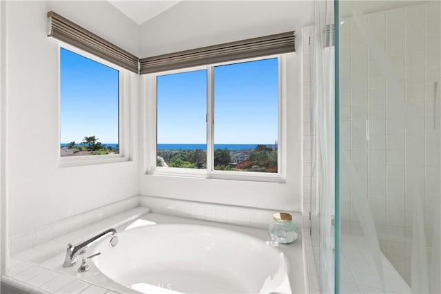 full bathroom featuring tiled shower and a garden tub