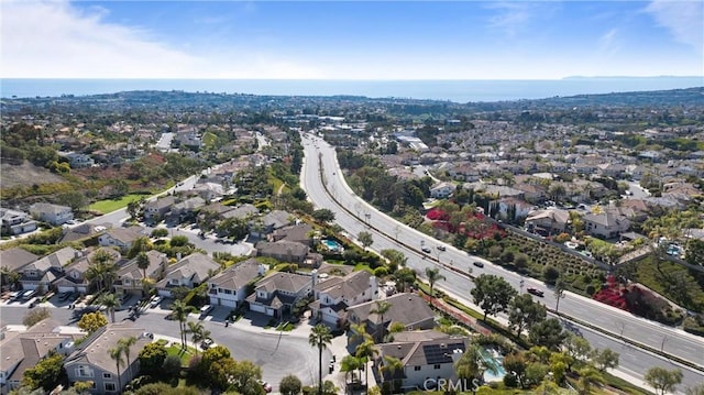 birds eye view of property with a residential view and a water view