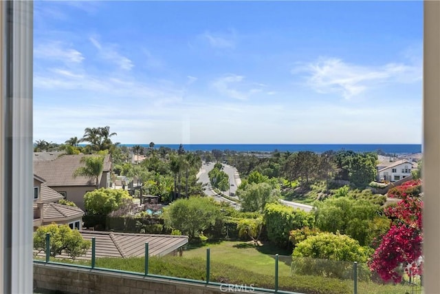 property view of water featuring fence