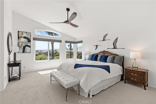 carpeted bedroom with a ceiling fan and lofted ceiling