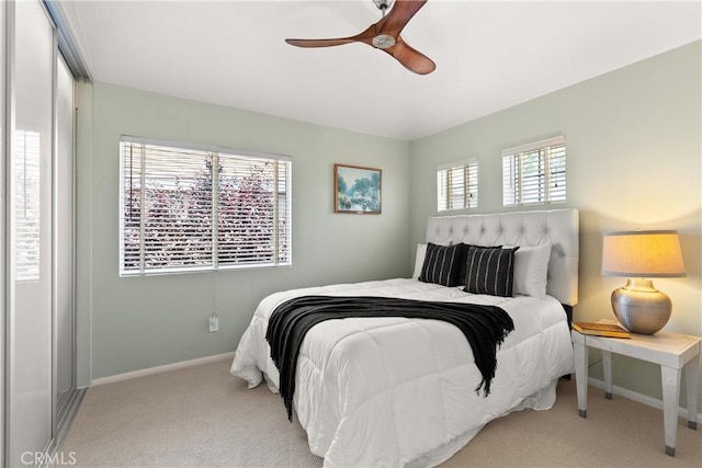 bedroom featuring a ceiling fan, baseboards, and carpet floors