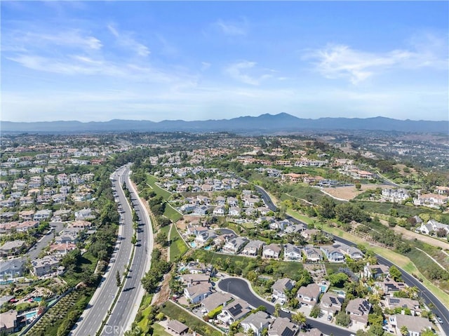 birds eye view of property with a mountain view and a residential view