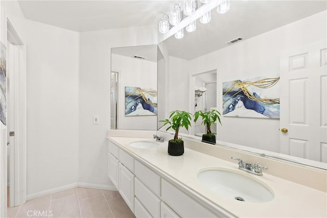 bathroom with tile patterned floors, double vanity, visible vents, and a sink