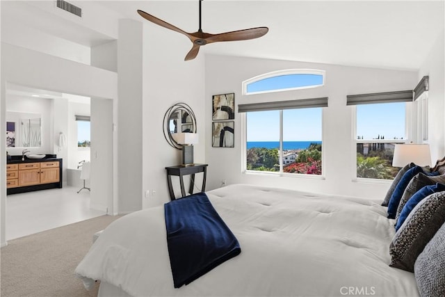 carpeted bedroom with visible vents, multiple windows, high vaulted ceiling, and ceiling fan