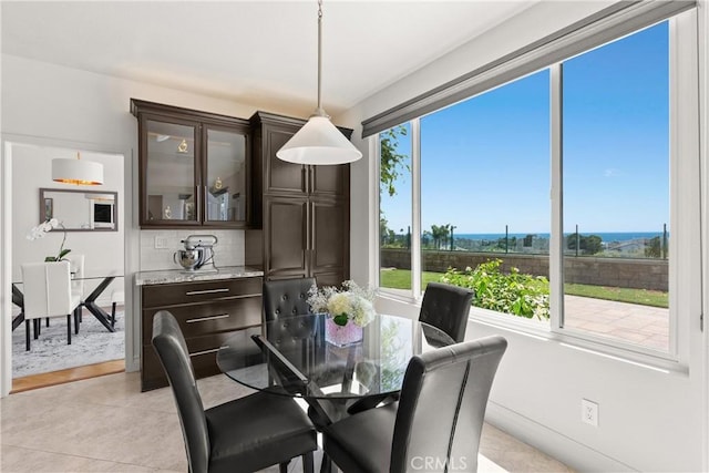 dining area with light tile patterned flooring