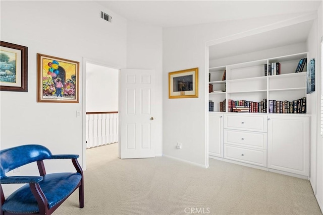 sitting room featuring visible vents, lofted ceiling, carpet, and baseboards