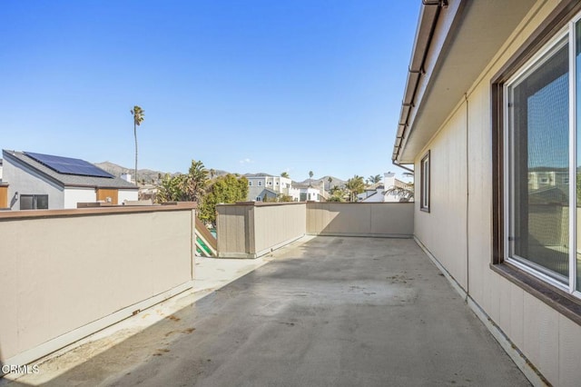 view of patio / terrace with a residential view and a balcony