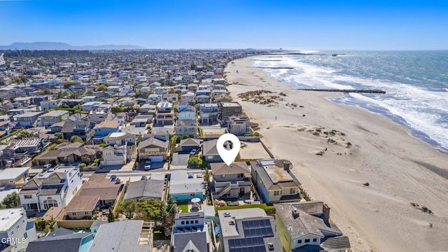 birds eye view of property featuring a residential view, a beach view, and a water view