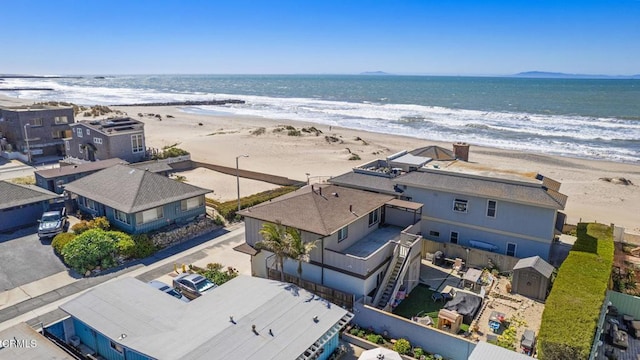 bird's eye view featuring a beach view and a water view