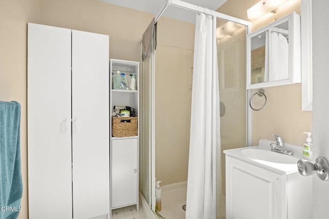 bathroom featuring vanity and a shower stall