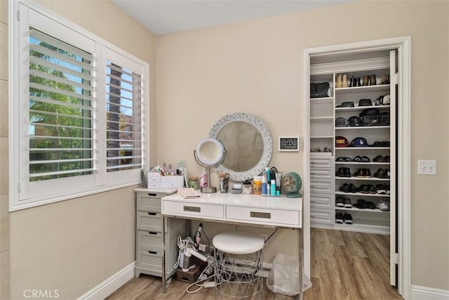 office space with light wood finished floors and baseboards