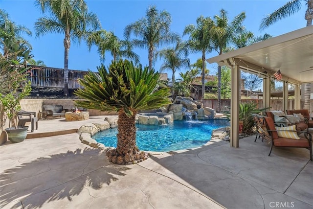 view of pool featuring a fenced backyard, a fenced in pool, outdoor lounge area, and a patio