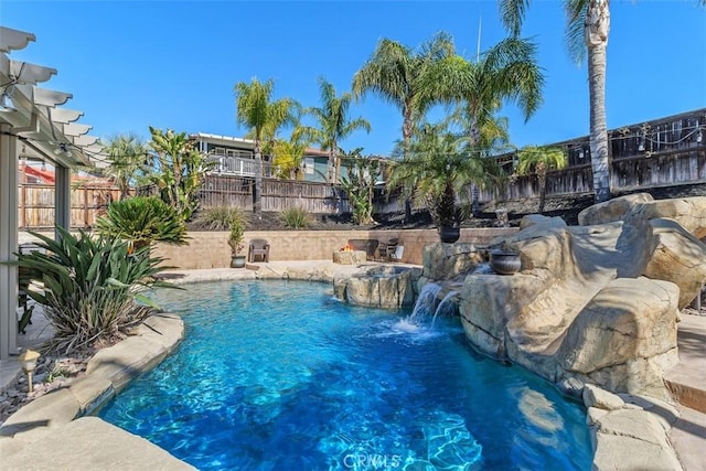 view of swimming pool with a fenced in pool and a fenced backyard